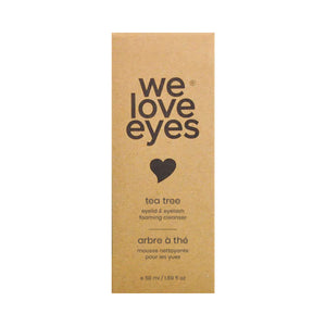 A 25mL mini cardboard box with a heart icon labeled We Love Eyes by the brand We Love Eyes features tea tree oil in its eyelid & eyelash foaming cleanser, also known as arbre à thé.