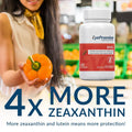 At the supermarket, a woman holds an orange bell pepper while prominently featured in the foreground is a bottle of EyePromise DVS Eye Vitamin, noted for containing 4x More Zeaxanthin and supporting enhanced retinal health to improve eye wellness, especially for diabetic retinopathy.