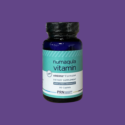 A bottle of PRN nūmaqula Vitamin, an AREDS2 based supplement with unique enhancements for advanced macular support (90ct), is centered on a purple background. The label emphasizes lutein and zeaxanthin.